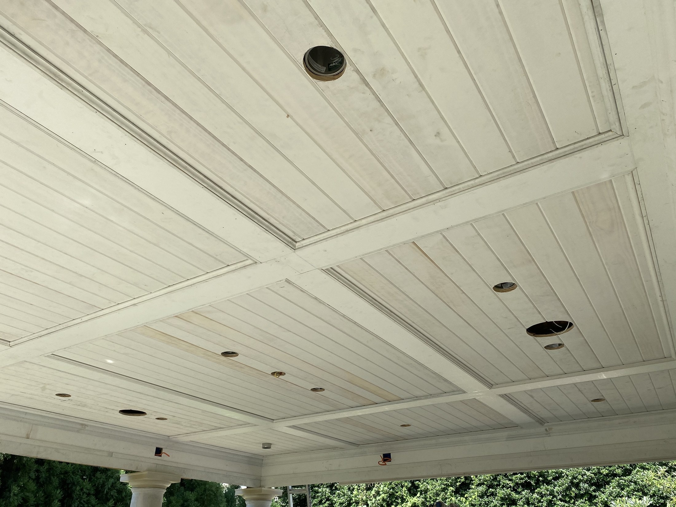 Stained tongue-and-groove porch ceiling
